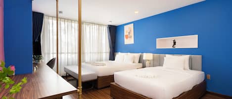 Deluxe Triple Room | 1 bedroom, desk, laptop workspace, blackout curtains