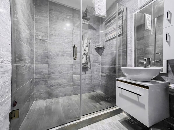 Shower, rainfall showerhead, towels