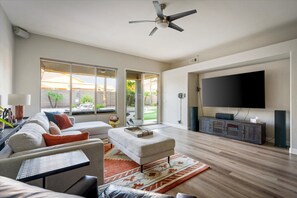 Flat-screen TV, table football, smart speakers, music library
