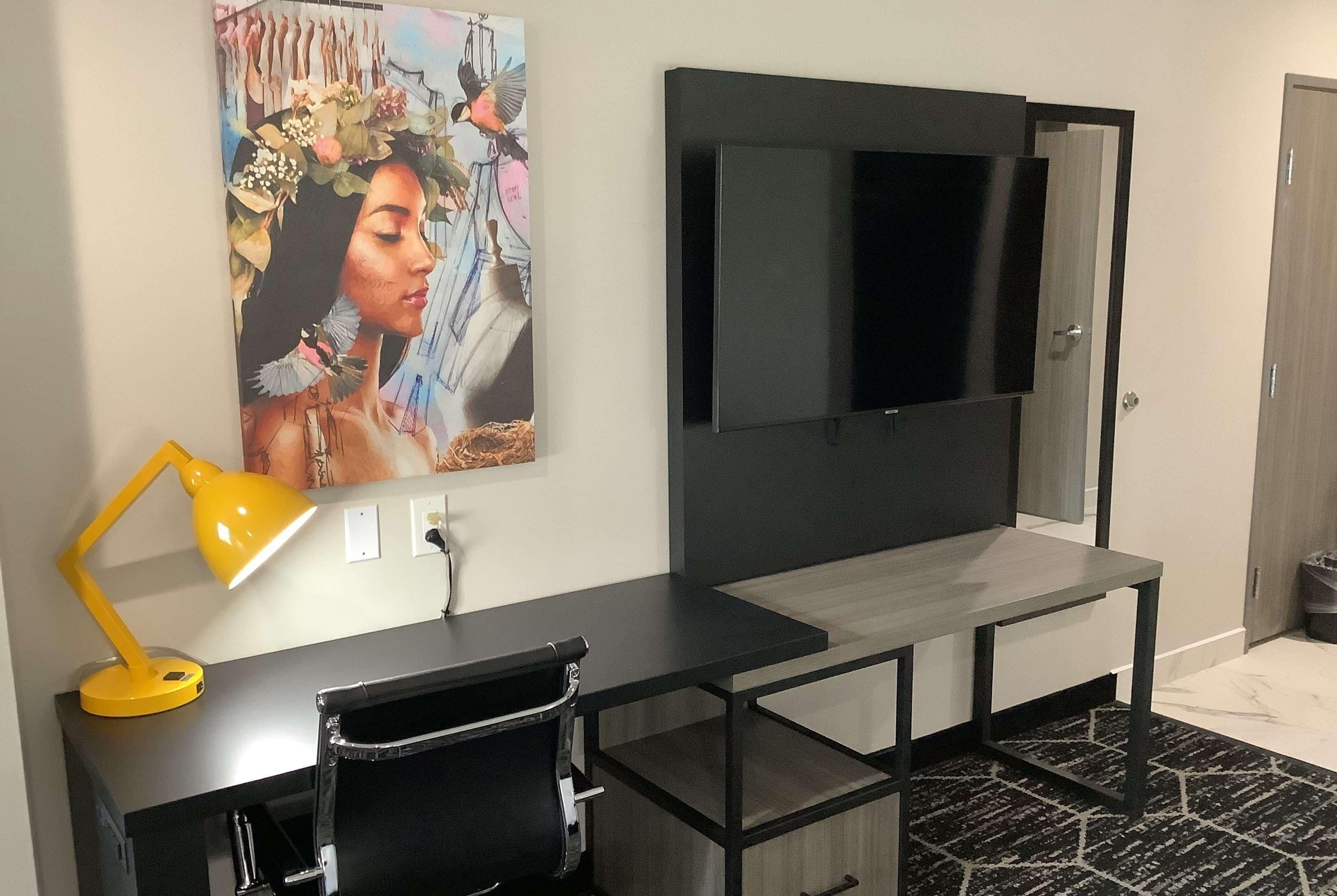 pillow-top beds, desk, laptop workspace, blackout curtains