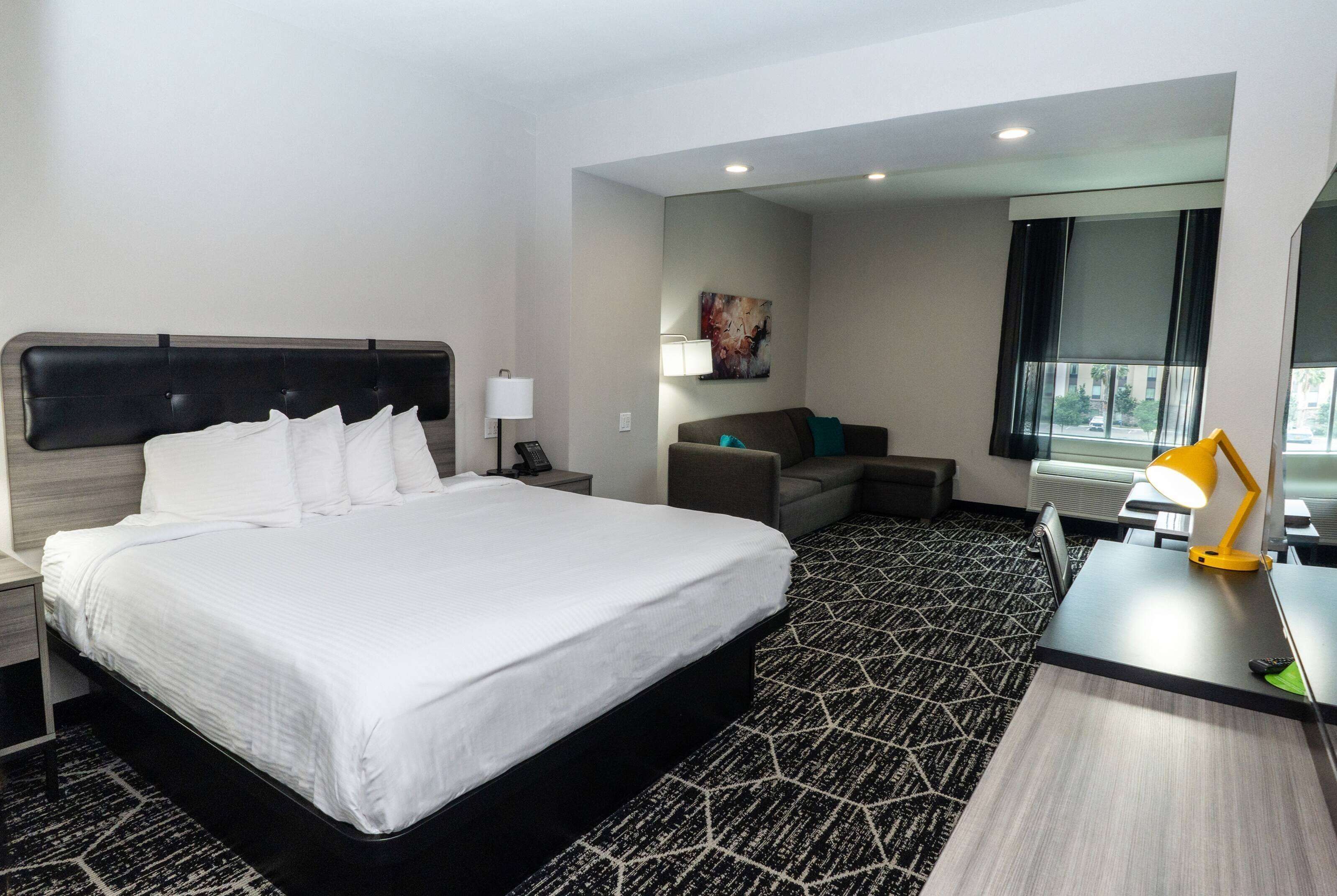 deluxe room, 1 king bed, non smoking | pillow-top beds, desk, laptop workspace, blackout curtains