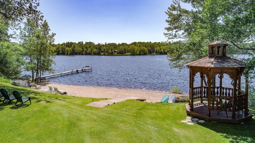 Historic prohibition Lodge next to golf course with private beach