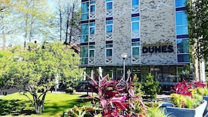 A modern hotel building with a brick facade and large windows. - Grand Baltic Dunes (Palanga)