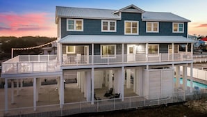 A two-story house with a balcony and a pool. - Spacious Home with Private Pool, Steps from the Beach & Marsh Views (Murrells Inlet)