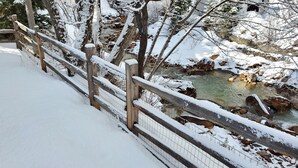 A wooden bridge over a snow-covered stream with a fence on one side. - Will it be ICE AXE, CRAWLER, NORDIC? 1200MGPS-Mtn Views! On River! BBQ & yard! (Ouray)
