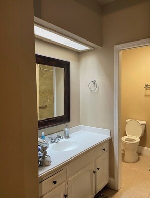 Combined shower/tub, hair dryer, towels, soap