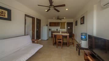 Standard Apartment, 1 Queen Bed with Sofa bed | Living area | 50-inch flat-screen TV with cable channels, TV