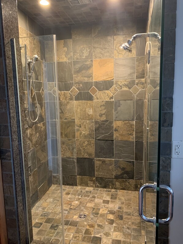 Bathtub, jetted tub, hair dryer, towels