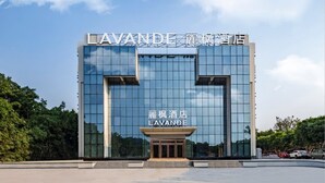 A modern hotel building with a prominent sign reading "LAVANDE" and Chinese characters above it. - Lavande Hotel - Guangzhou Panyu Chimelong (Guangzhou)