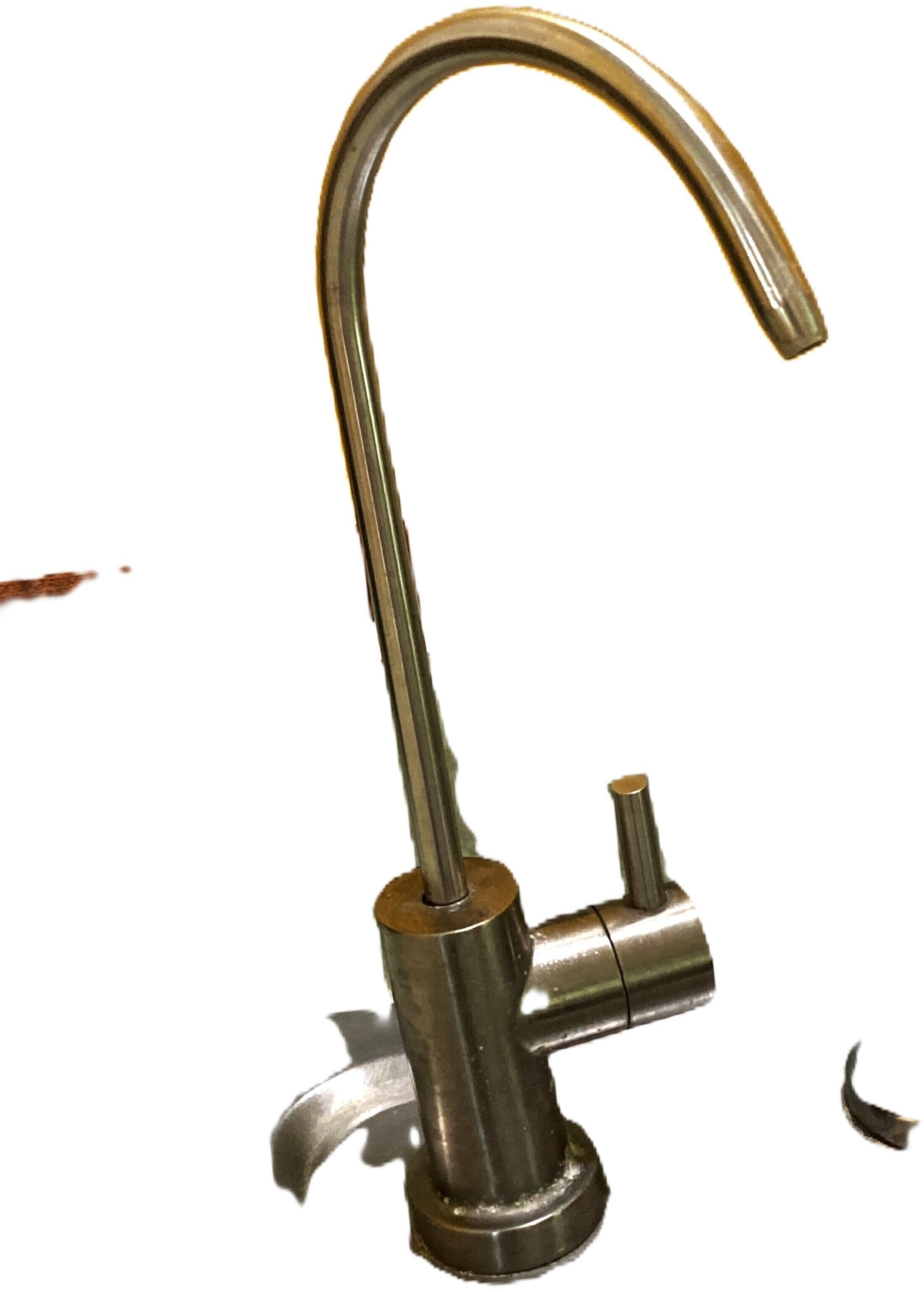 A metallic faucet with a curved spout and a separate handle.