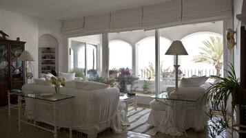 Apartment, 2 Bedrooms, Smoking, Private Pool | Living area | TV, books