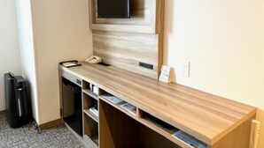A modern room with a built-in TV, a desk with a telephone, and a compact dishwasher. - Smile Hotel Kitaasaka (Asaka)