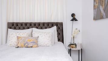 1 bedroom, desk, iron/ironing board, travel crib