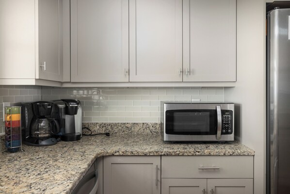 Coffee/tea maker, fridge, dishwasher, cookware/dishes/utensils