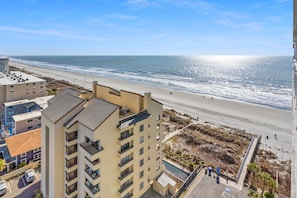 A high-rise hotel overlooking a beach with a clear view of the ocean. - Modern, ocean view condo, pool, lazy river, fitness center - perfect for families (North Myrtle Beach)