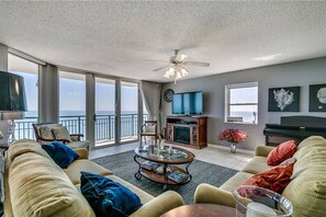 Flat-screen TV, fireplace, DVD player, books