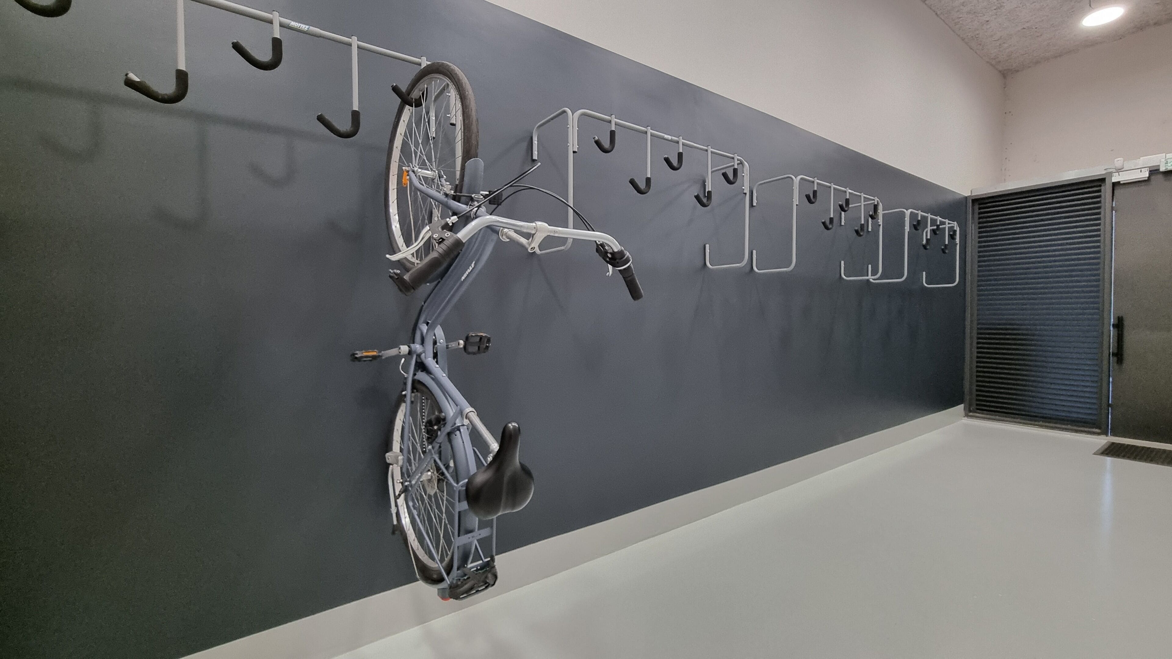 A bike rack with two bicycles mounted on it.