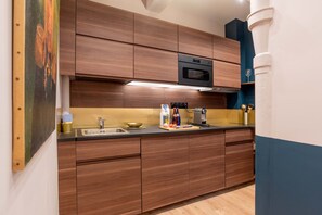 Fridge, microwave, stovetop, coffee/tea maker