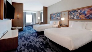 A hotel room with two beds, a desk, a flat-screen TV, a painting, and a large window with curtains. - Fairfield Inn & Suites by Marriott St. Paul Eagan (Eagan)