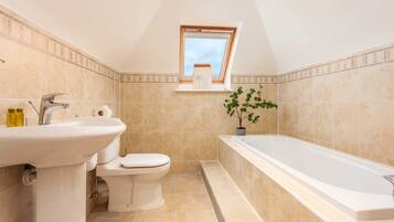 Bathtub, hair dryer, towels