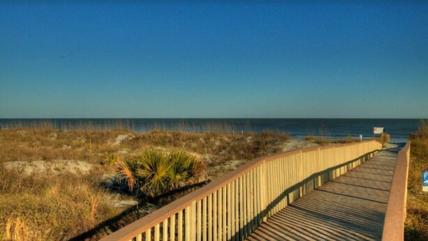 A wooden boardwalk leading to the beach with a clear view of the ocean. - Wildlife Watching! Lagoon & Golf view, beach gear included. Peaceful & Private! (Hilton Head Island)