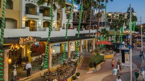 A restaurant named Jack's Steak House with outdoor seating and palm trees. - Fantastic Studio in Cabo San Lucas (Cabo San Lucas)