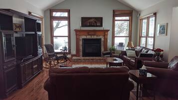 Smart TV, fireplace, books, music library