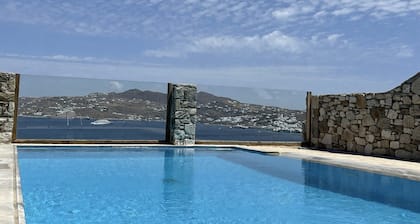 Natural Stone Villa has amazing view in town and aegean private pool free park