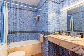 Bathtub, hair dryer, towels