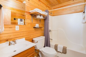 Combined shower/bathtub, hair dryer, towels, soap