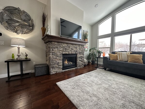 Smart TV, fireplace, table football, books