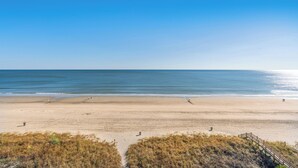A beach with a wooden walkway leading to the shore. - Sanabel 506, Affordable Oceanfront 2BR 2BA condo (North Myrtle Beach)