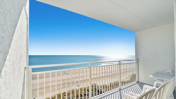 A balcony with a view of the beach and ocean. - Sanabel 506, Affordable Oceanfront 2BR 2BA condo (North Myrtle Beach)
