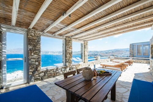 Natural Stone Villa has amazing view in town and aegean private pool free park