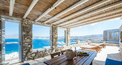 Natural Stone Villa has amazing view in town and aegean private pool free park
