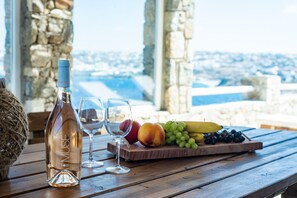 Outdoor dining - Natural Stone Villa has amazing view in town and aegean private pool free park (C8M8+P2 Mykonos, Greece)