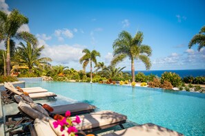 2 outdoor pools, pool umbrellas, pool loungers