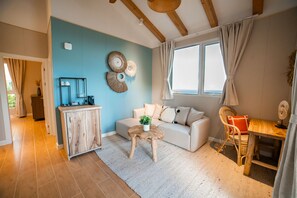 2 Bedroom Cottage | Living area | 55-inch flat-screen TV with satellite channels, TV, streaming services - Golden Rock Dive And Nature Resort (Oranjestad)