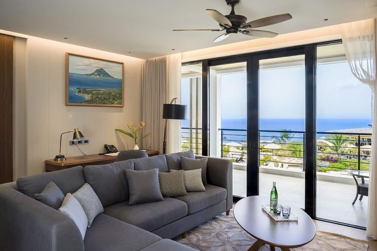 Golden Rock Suite | Living area | 55-inch flat-screen TV with satellite channels, TV, streaming services