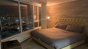 A bedroom with a large window, a bed, and a floor lamp. - 3 bedroom Downtown Vancouver S.Penthouse, near skytrain, shopping & restaurants. (Vancouver)