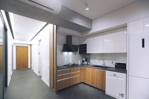 Enjoy cooking in this well-equipped kitchen with a microwave, dishwasher, and sink.