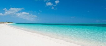  Waterfront Luxury Villa with Optional Boat and Beach Access Just Steps Away