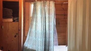 Combined shower/tub, hair dryer, towels, soap