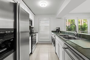 Fridge, microwave, oven, stovetop - Restoration Hardware PGA National Private Entrance Condo - Corner Unit (Palm Beach Gardens)