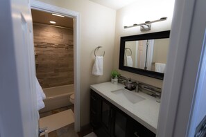 Combined shower/bathtub, hair dryer, towels, soap