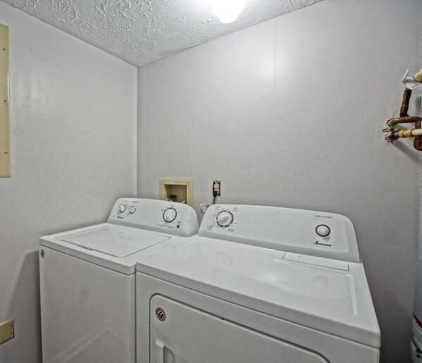 A laundry room with two front-loading washing machines and a dryer. - Let the fun begin ππββοΈπ<br>Located between both beaches (Rehoboth)