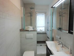 Shower, hair dryer, towels, soap