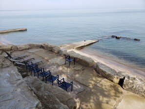 On the beach, sun loungers