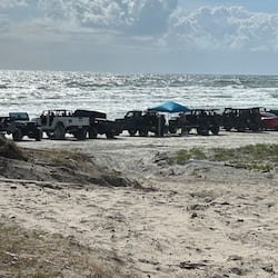 On the beach, sun-loungers