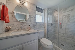 Combined shower/tub, hair dryer, towels, soap
